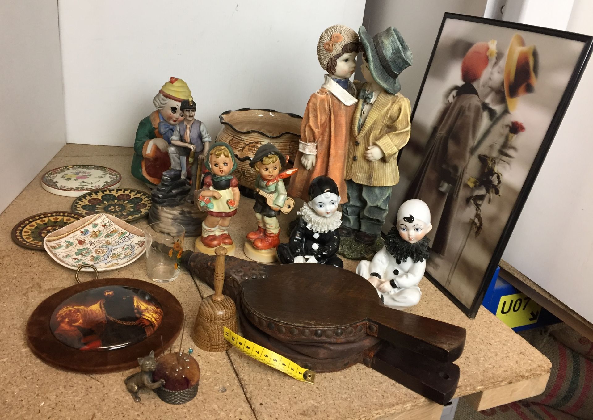 Eighteen items including seven figurines, wooden bellows,