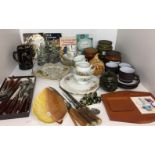 Contents to part of shelf including glass cruet set on stainless steel stand,