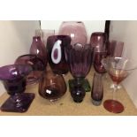 Eighteen items of purple glassware including eleven vases max 35cm high and seven glasses U05
