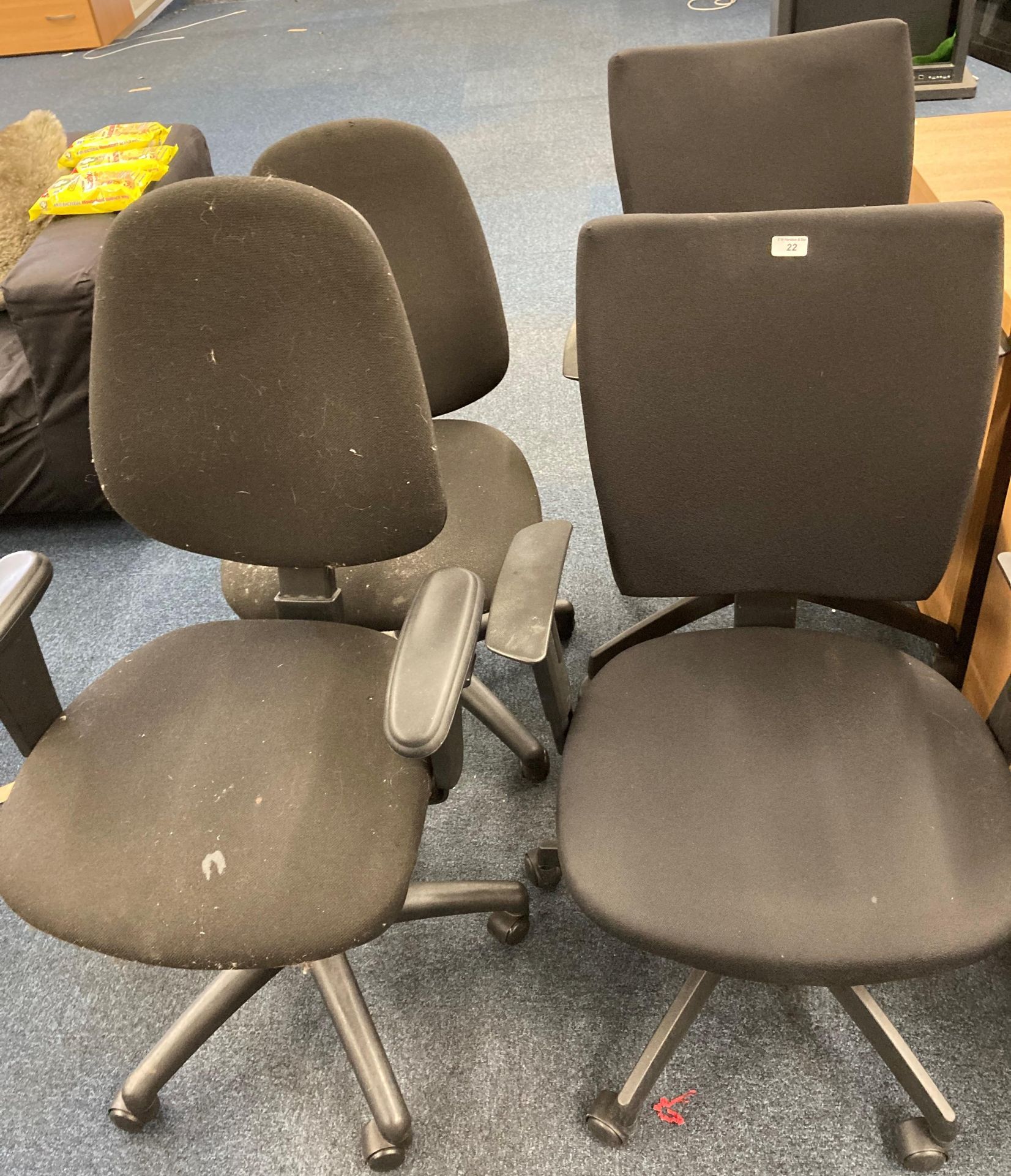 4 x assorted black cloth upholstered operators swivel chairs.