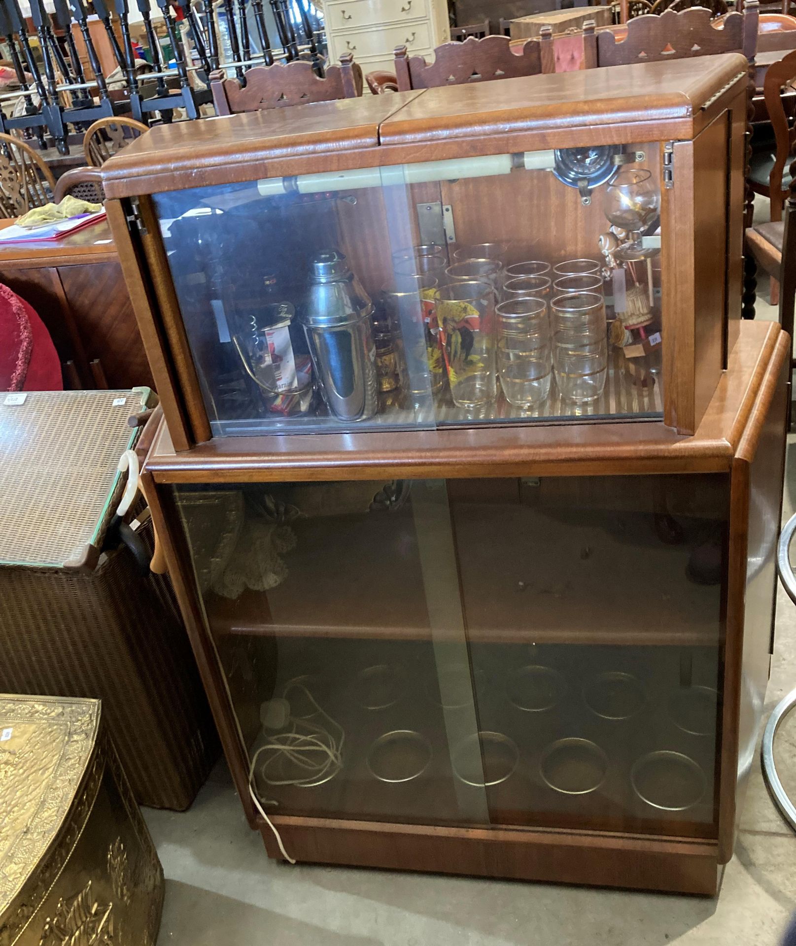 A 1950s walnut finish curved double sided bar with marble effect folding top over two doors and - Image 7 of 7