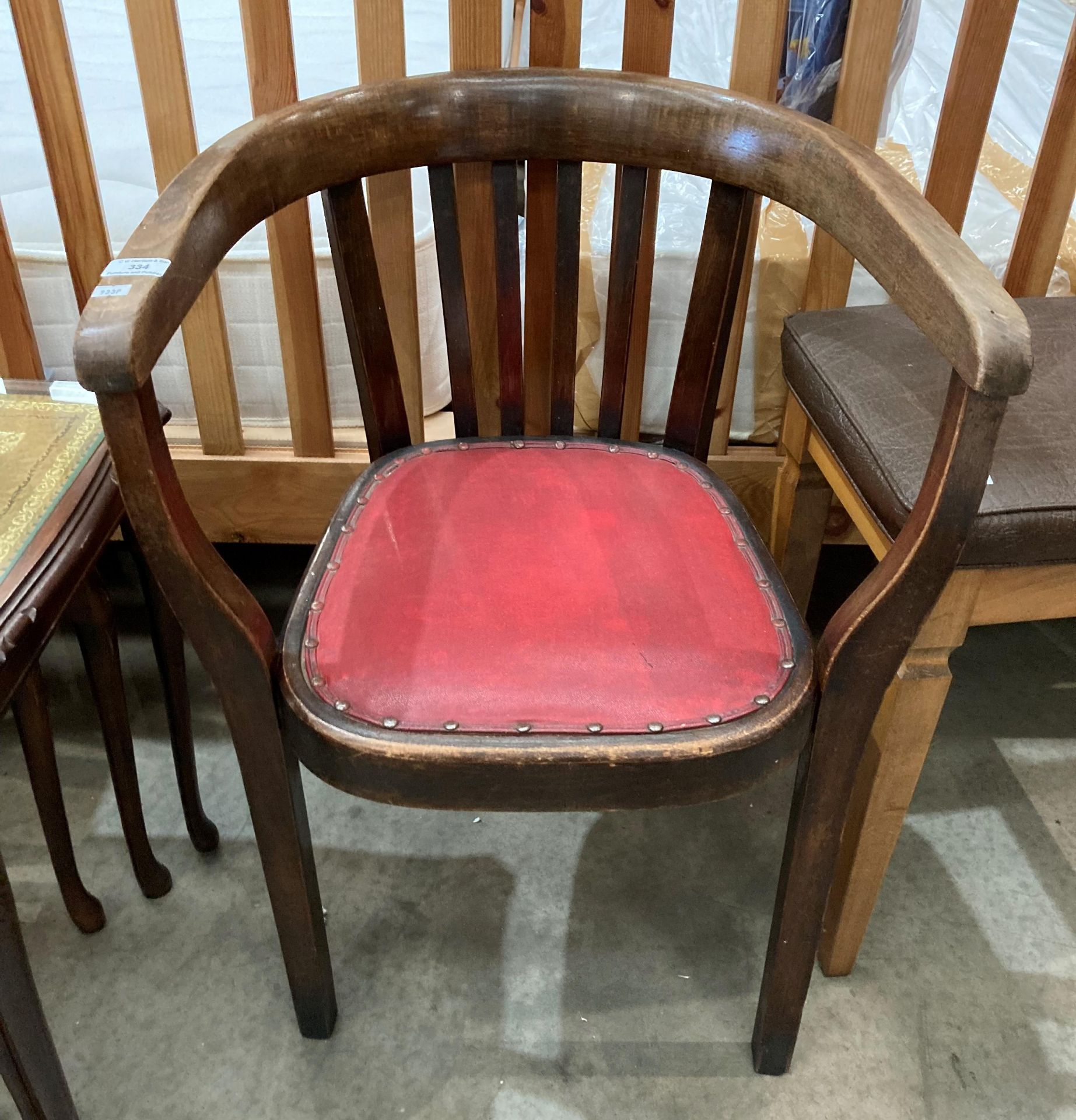 An oak armchair with red vinyl seat (MS)