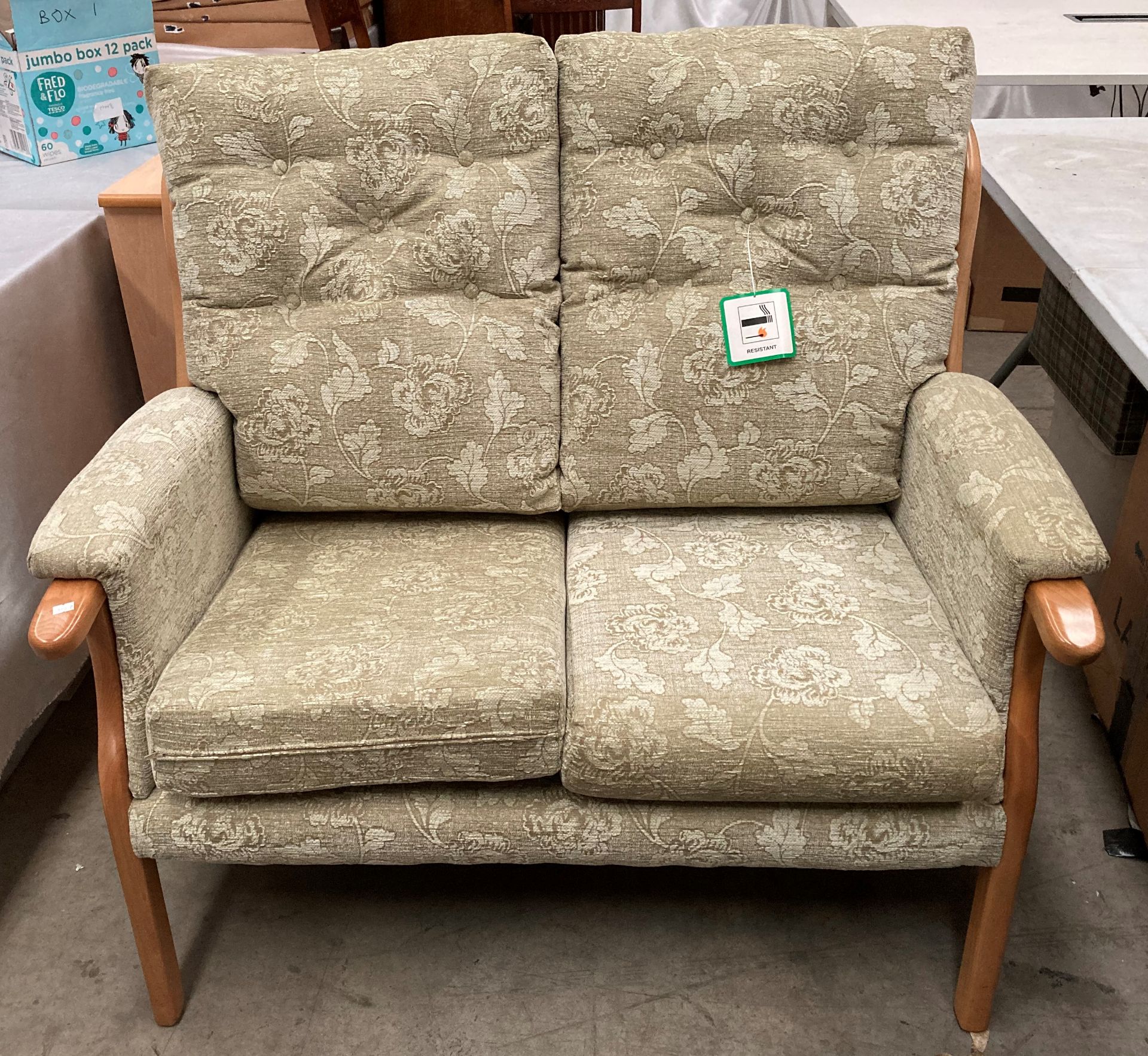 Beige material floral patterned 2 seater high back settee