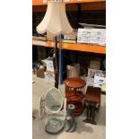 A mahogany finish standard lamp, a wood finish revolving rack, a concrete bird bath on stand,