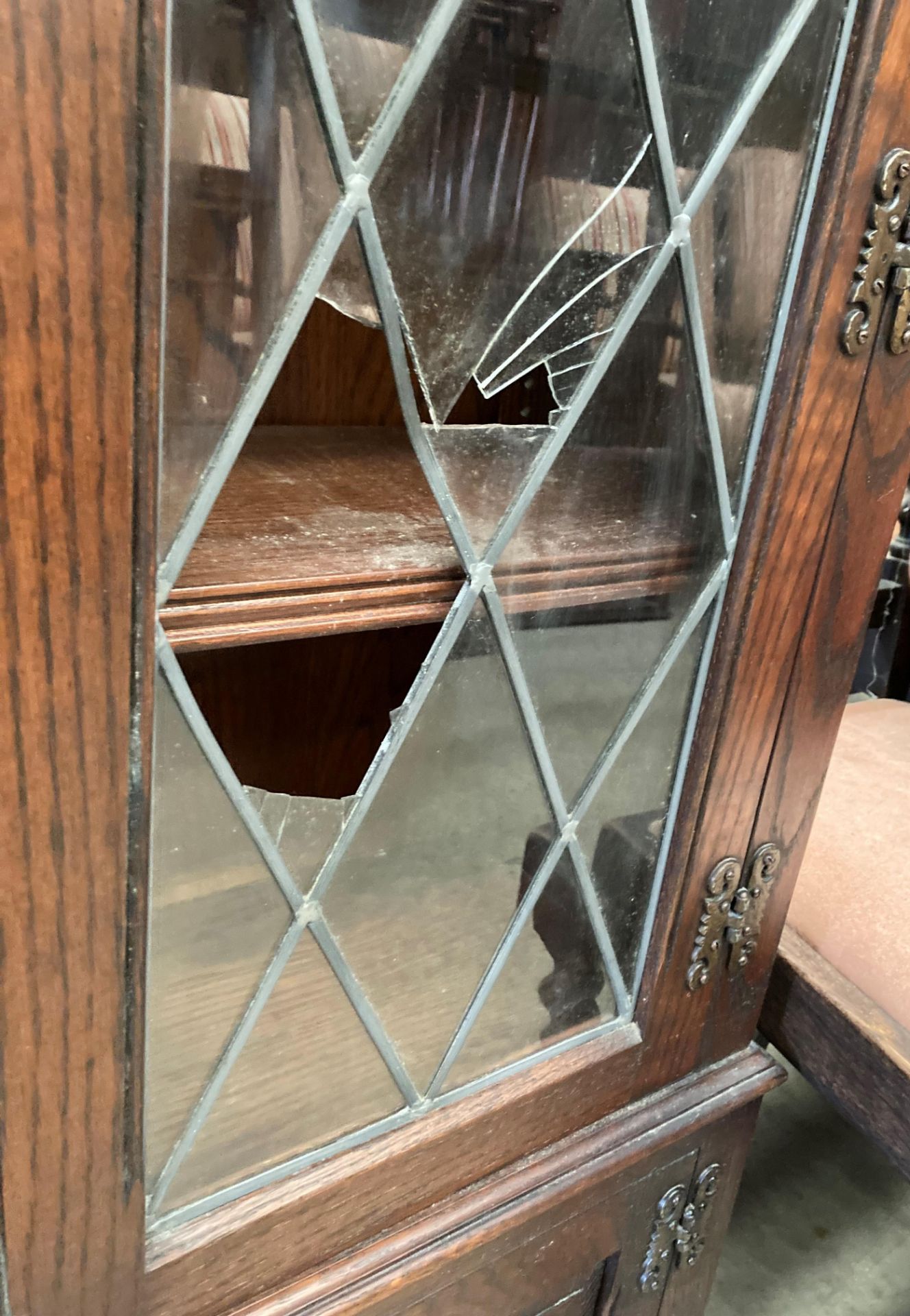 An Old Charm oak display cabinet with two leaded glazed doors (one damaged) over two door base, - Image 4 of 4