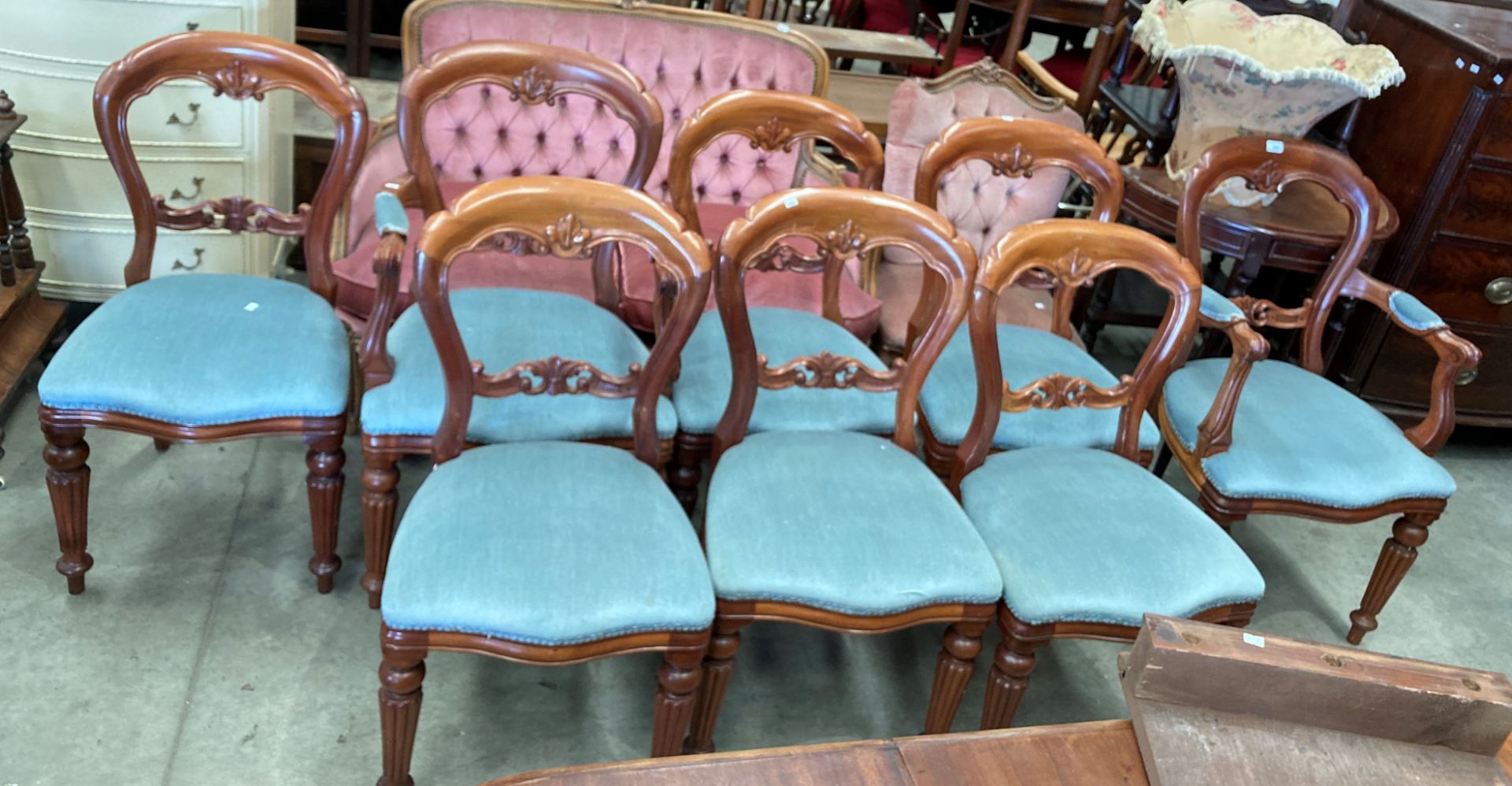 A set of eight reproduction mahogany Victorian style balloon back dining chairs (two carvers) with