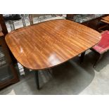 A G-Plan mahogany finish oval extending dining table,