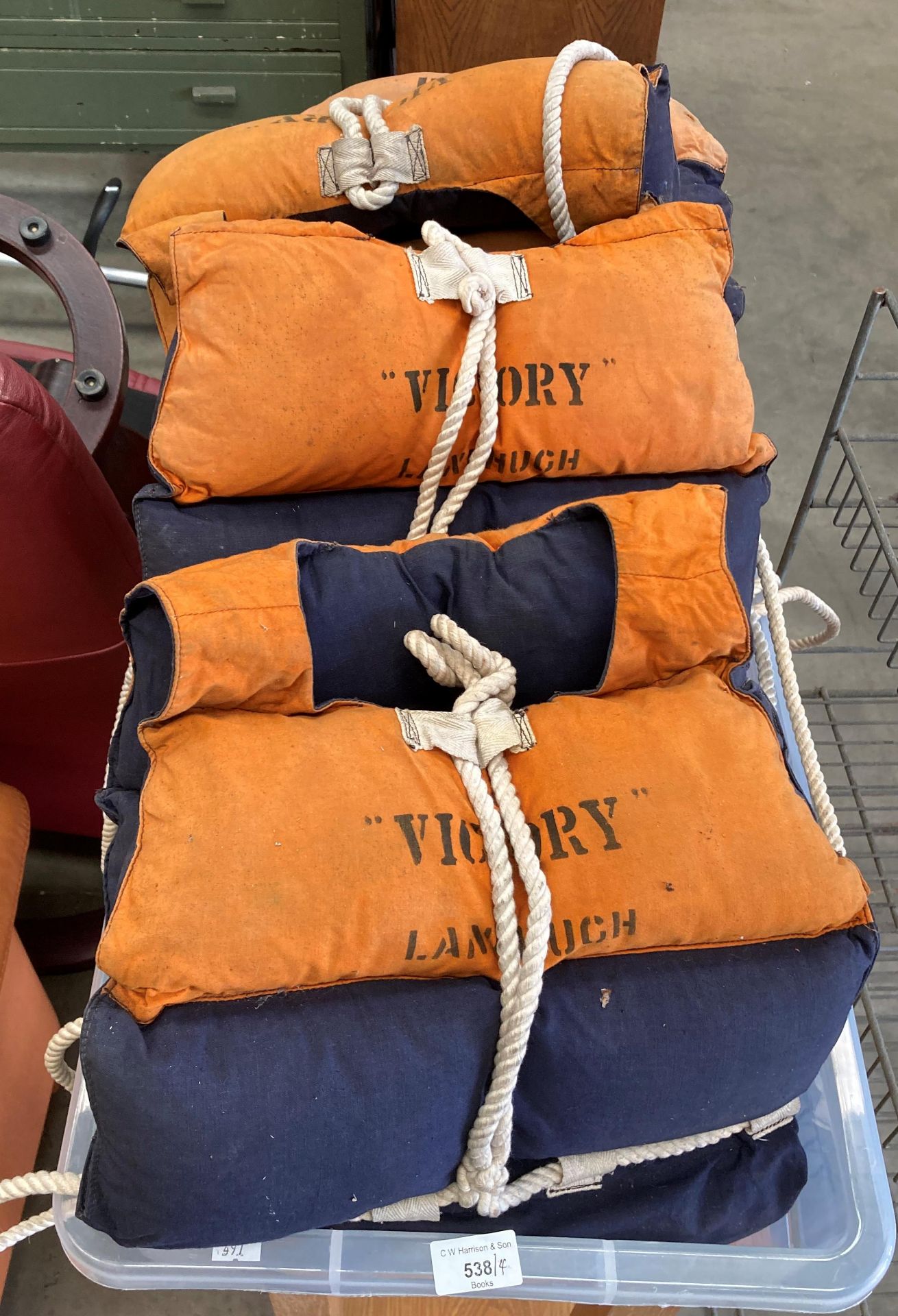 Four Second World War life jackets stencilled 'Victory,