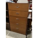 A teak finish five drawer chest of drawers,