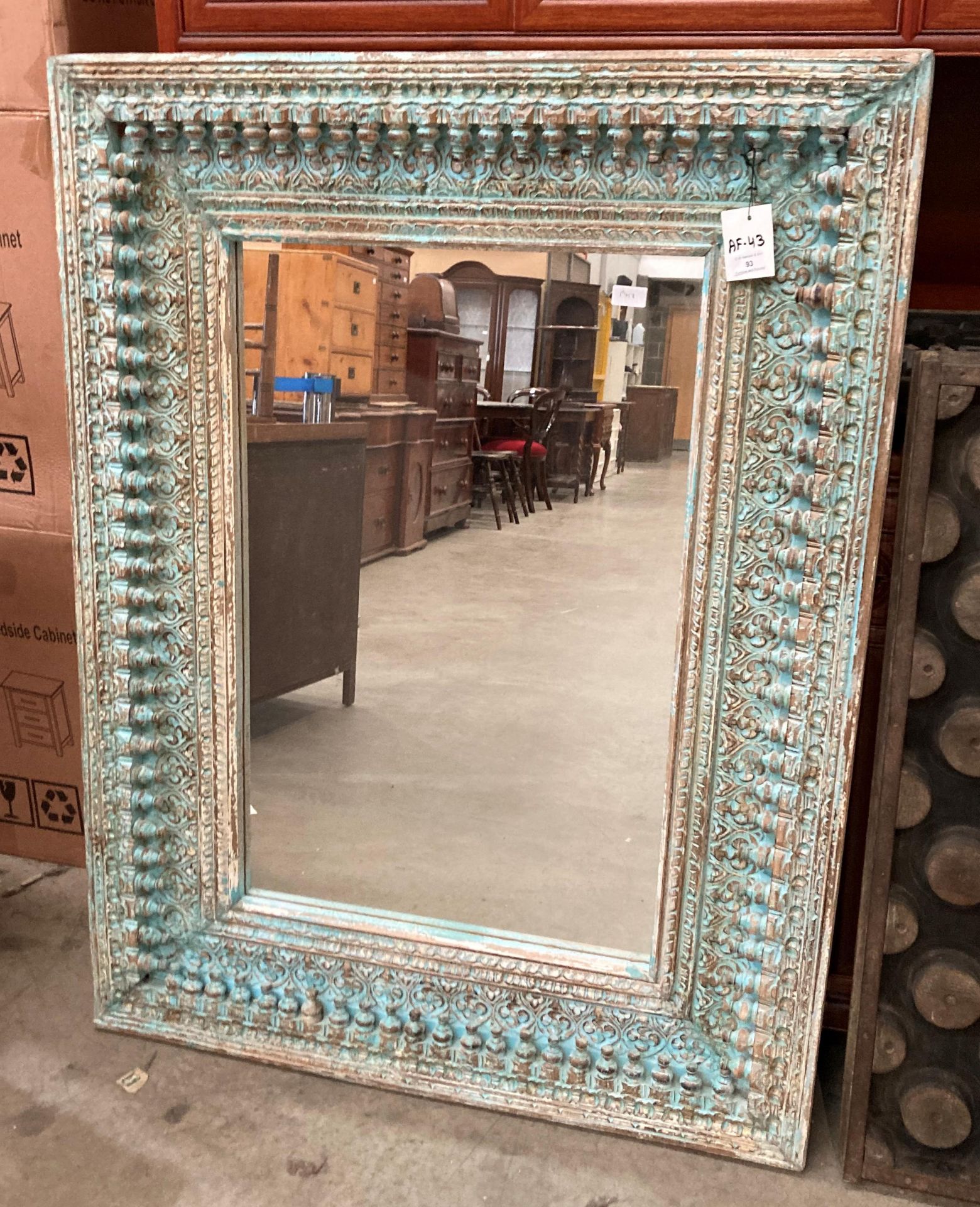 An Indian style distressed finish framed wall mirror (S3O) Further Information The