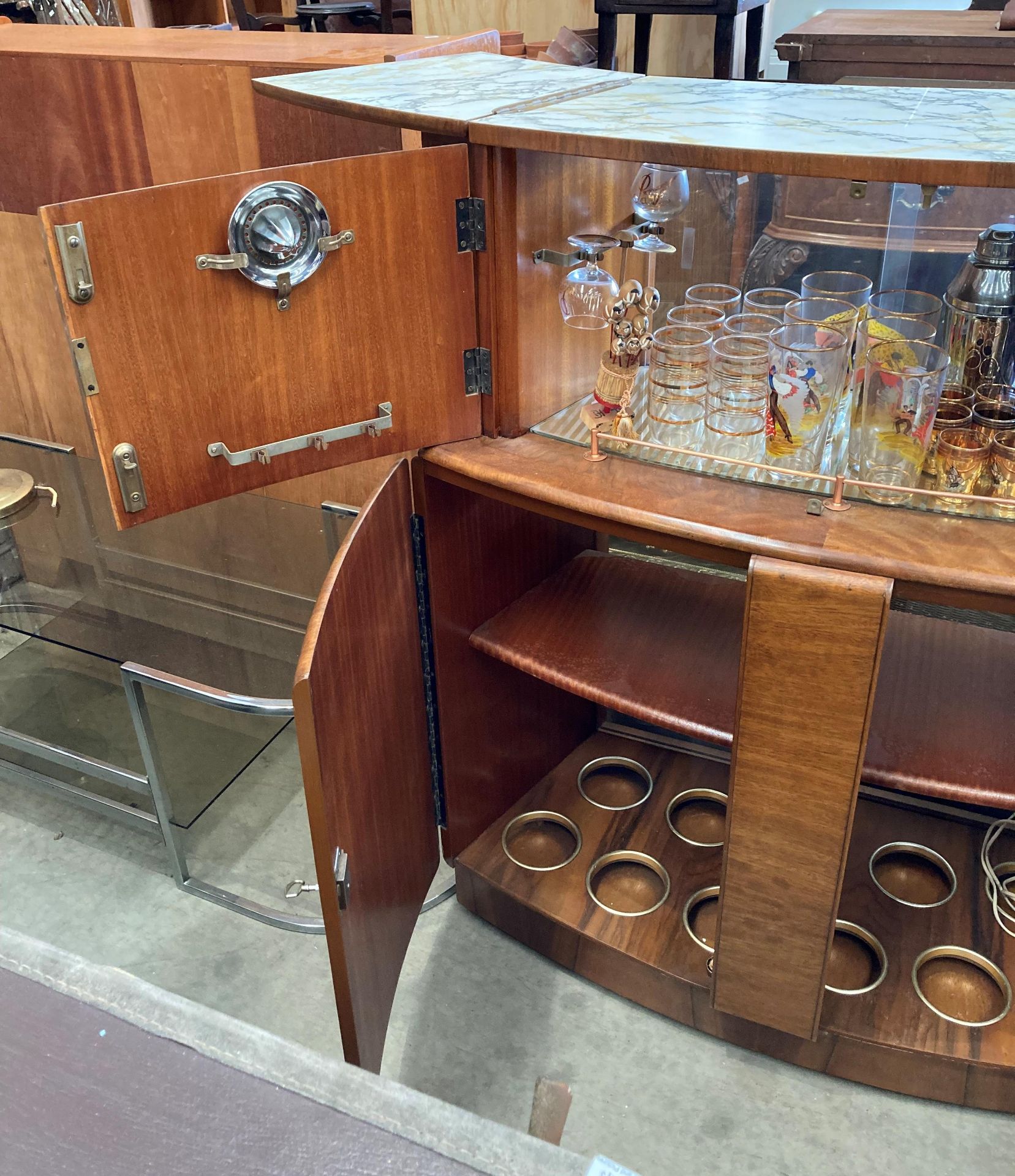 A 1950s walnut finish curved double sided bar with marble effect folding top over two doors and - Image 5 of 7