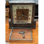 An oak mantel clock (face loose) complete with key (MST)