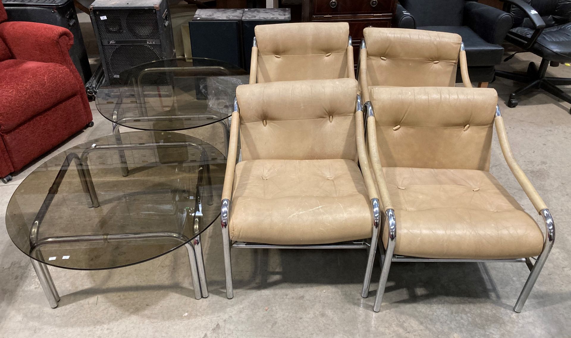 A 1970s vintage set of four chrome framed studio lounge chairs in light tan leather made by Pirelli,