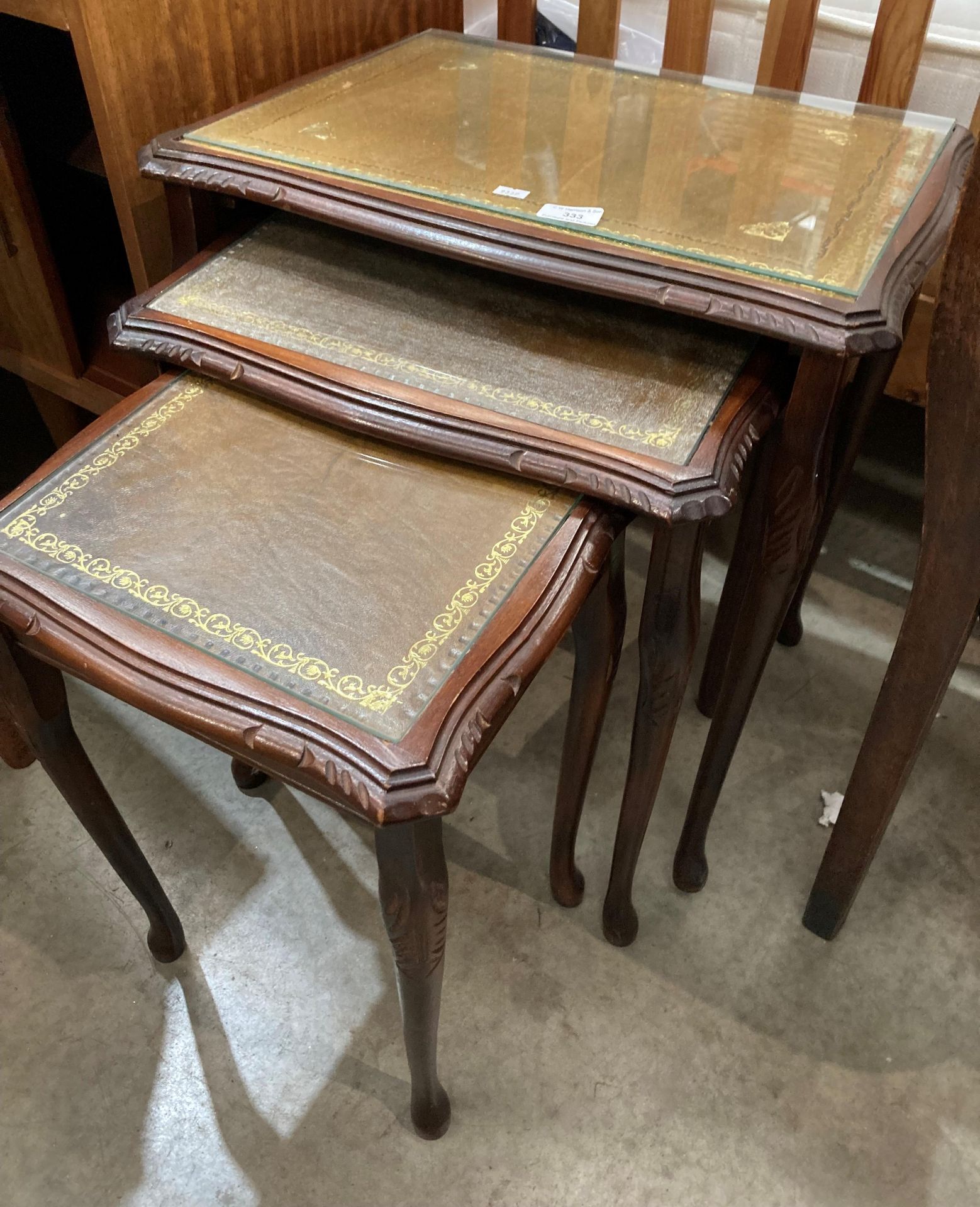 A mahogany finish nest of three coffee tables with brown tooled leather finish tops and glass - Image 2 of 2