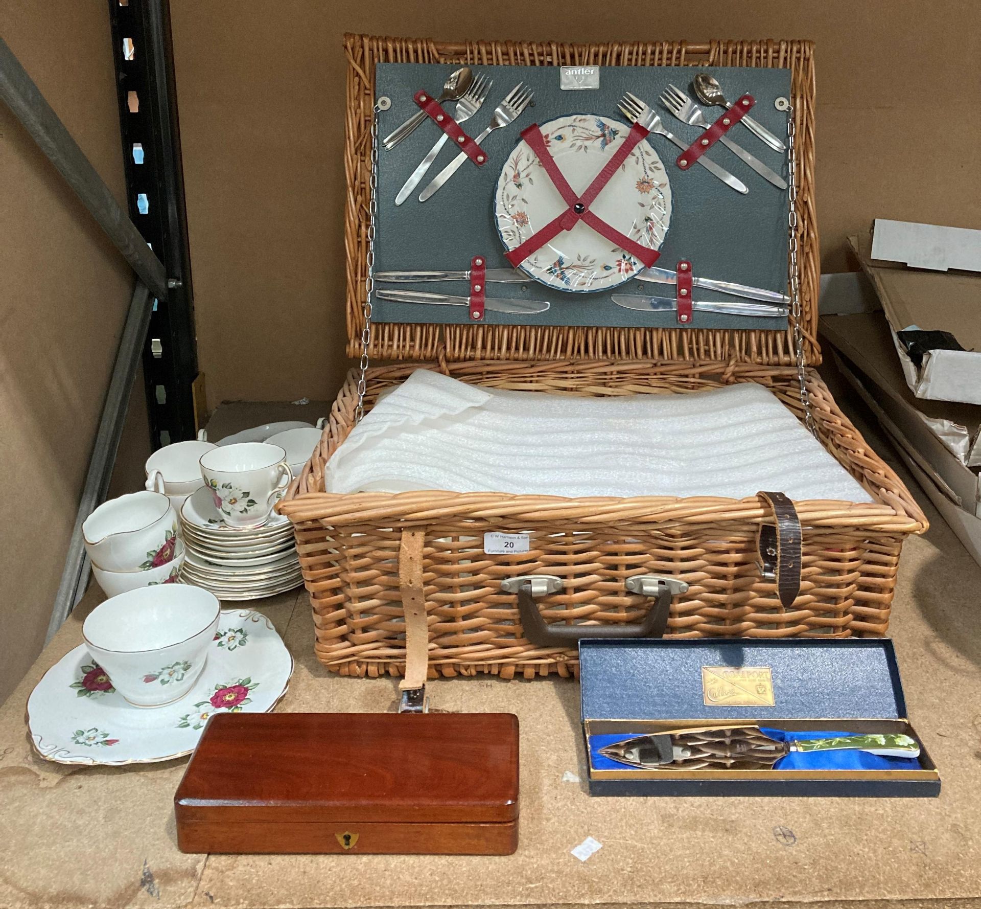 An Antler picnic set in a wicker basket, a Regency bone China tea service,