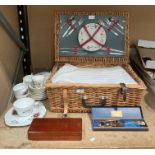 An Antler picnic set in a wicker basket, a Regency bone China tea service,