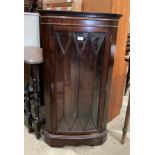 A mahogany floor standing corner cabinet with single Astragal glazed door 60cm x 109cm high (MST)