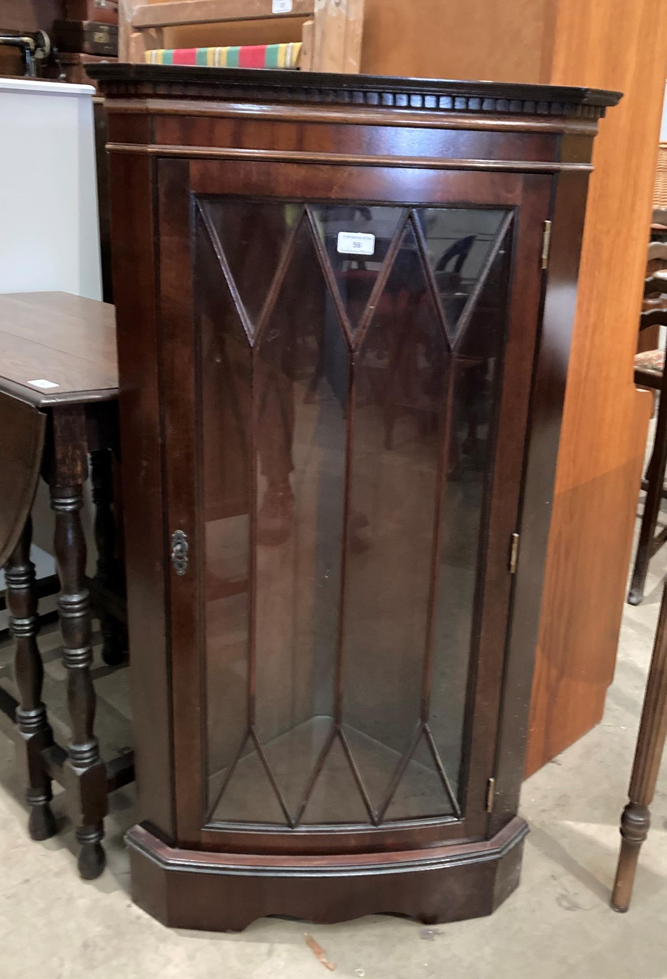 A mahogany floor standing corner cabinet with single Astragal glazed door 60cm x 109cm high (MST)