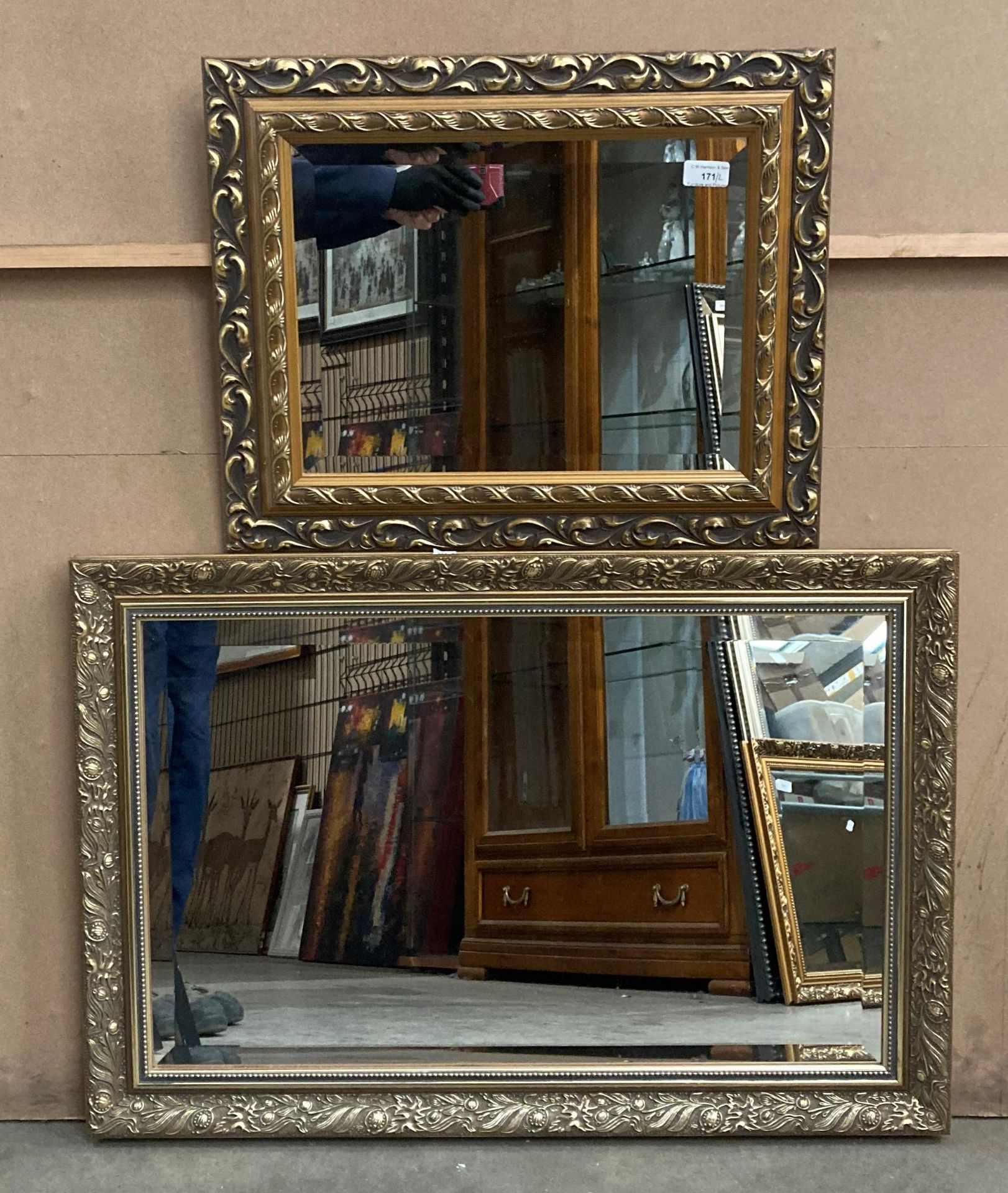 Two smaller ornate gilt framed wall mirrors,