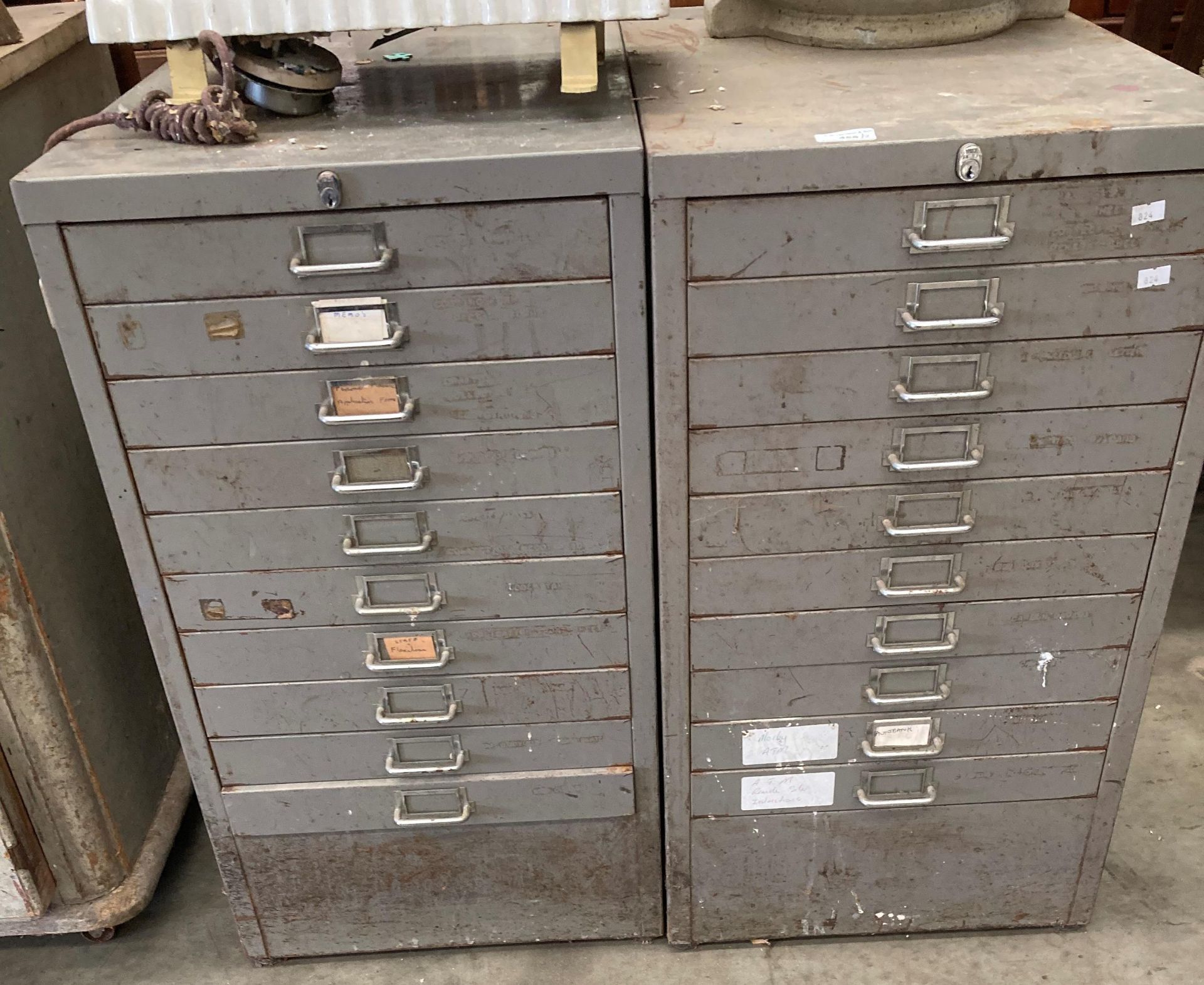 A pair of ten drawer grey metal index cabinets in distressed condition (MS)
