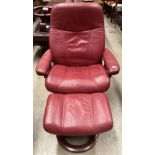 Ekornes Stressless dark red leather self reclining and revolving armchair with matching foot stool,