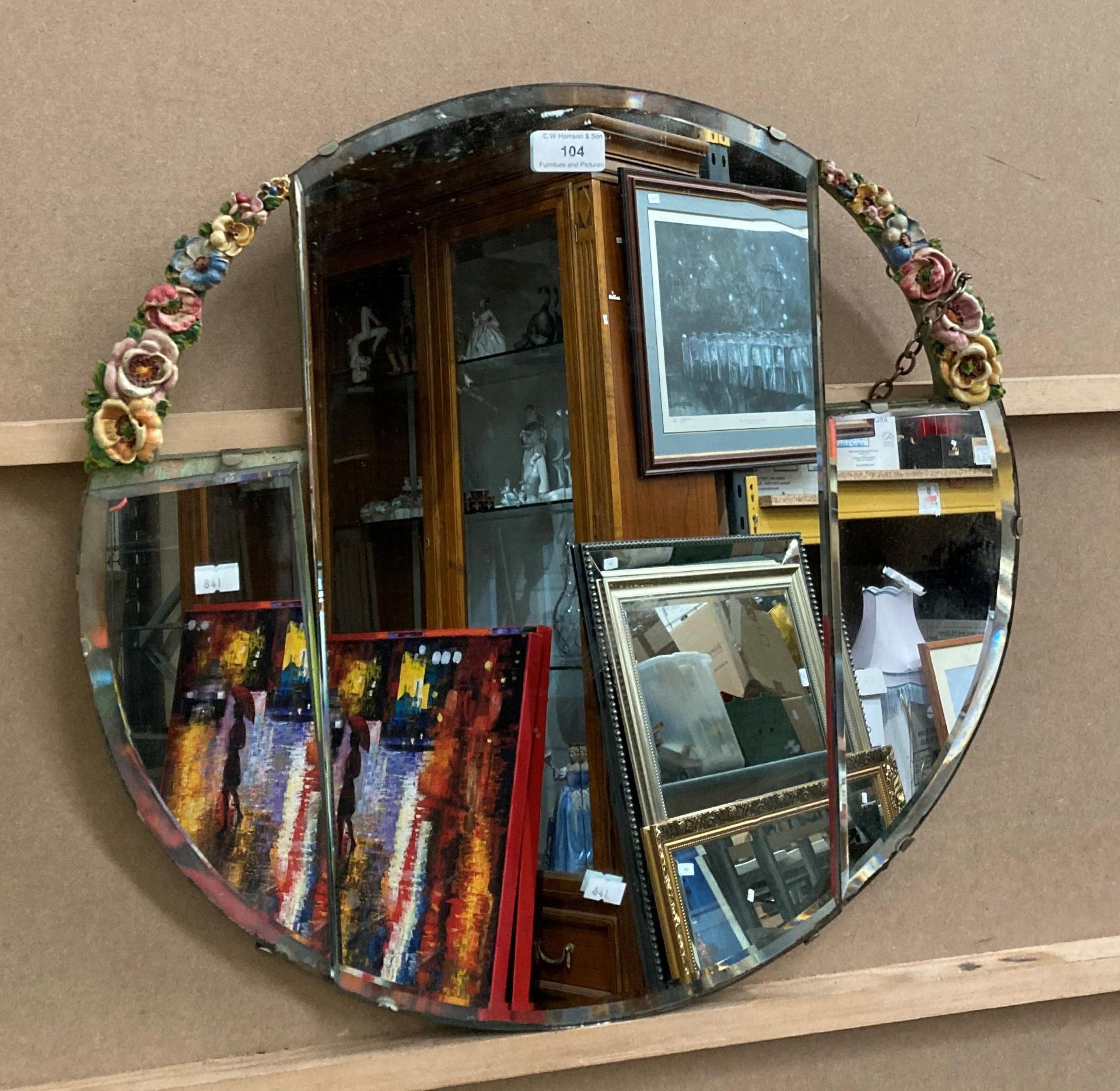 A circular wall mirror with floral decoration - one loose panel (SG)