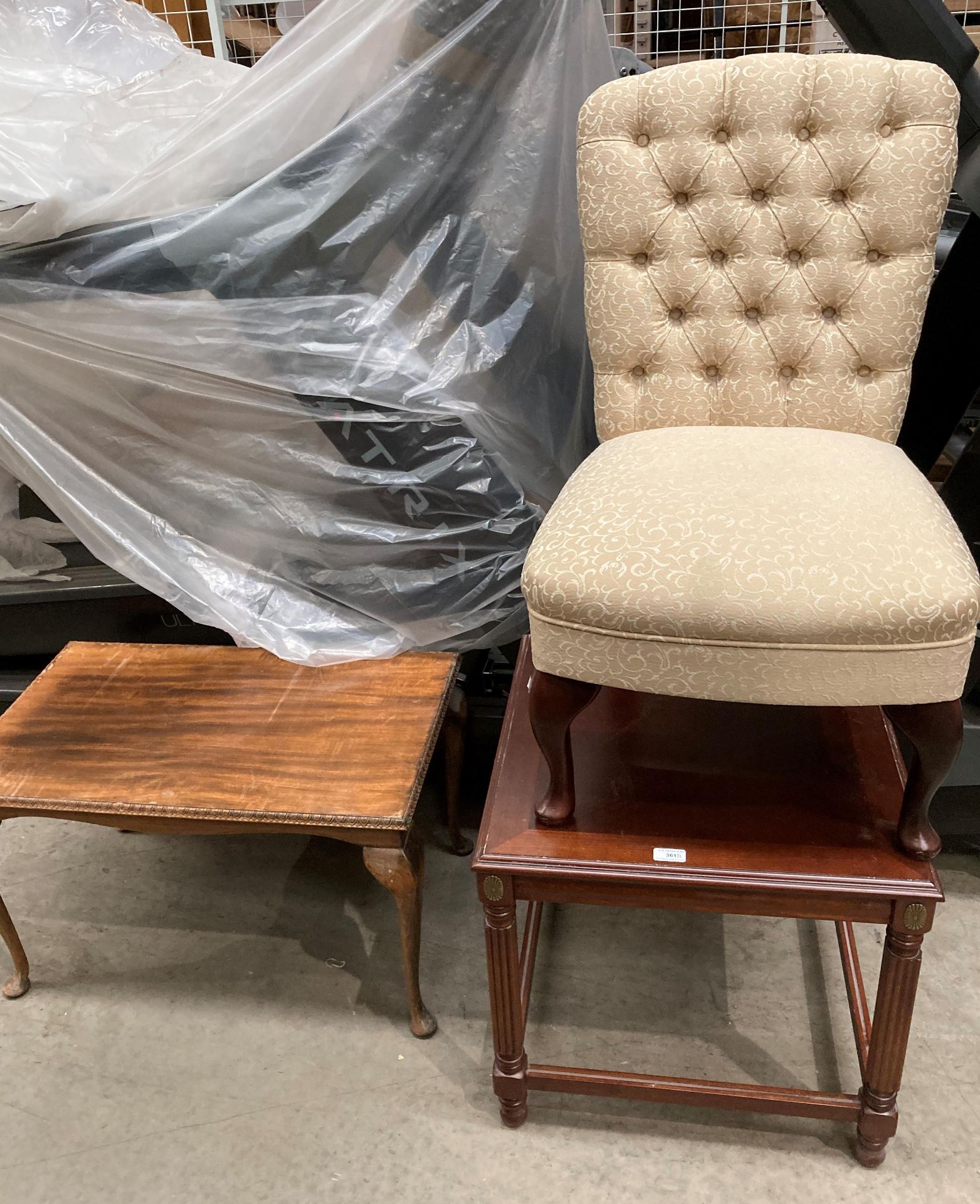 A walnut coffee table on cabriole legs,