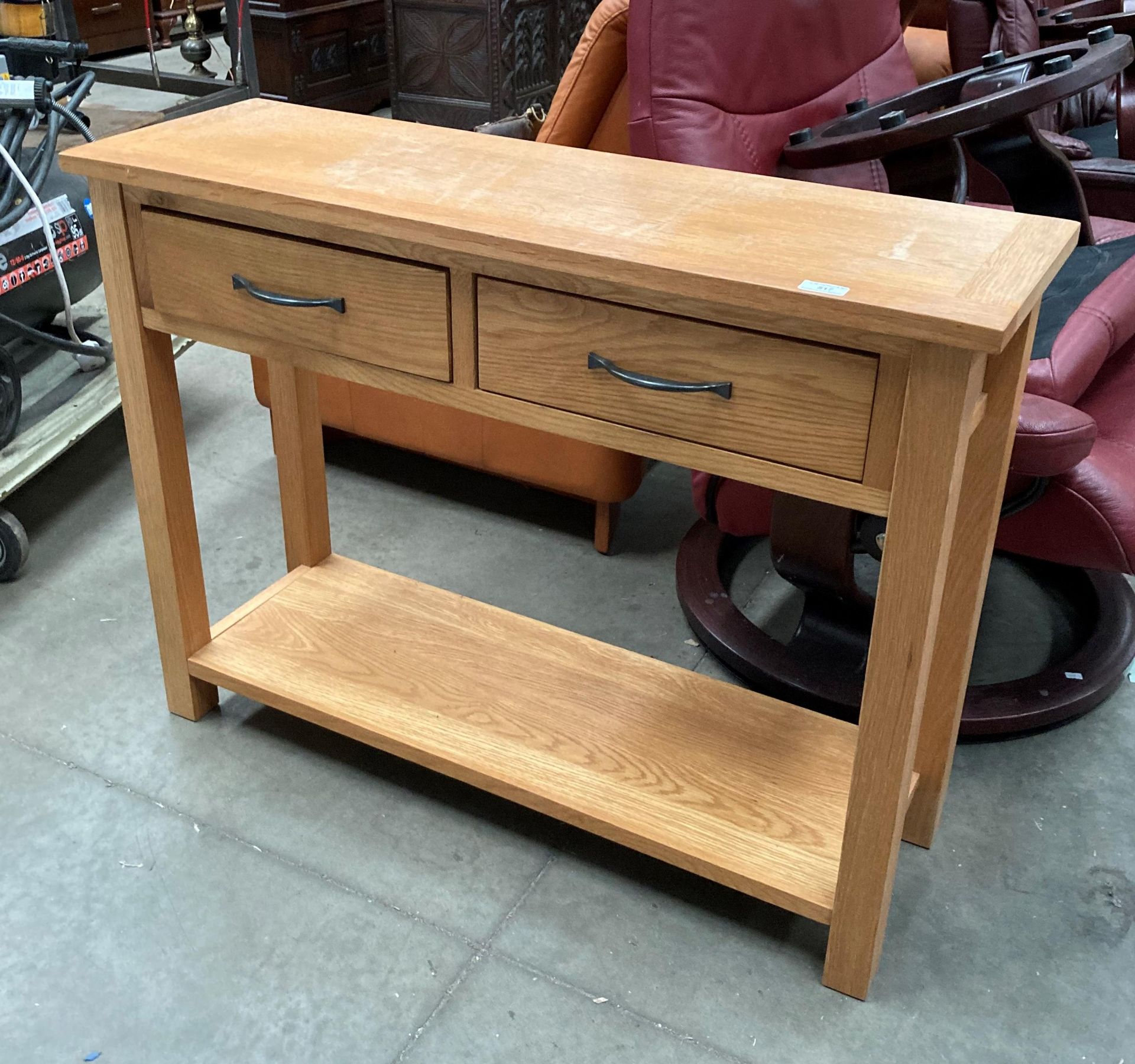 Light oak two drawer side table with under tray,