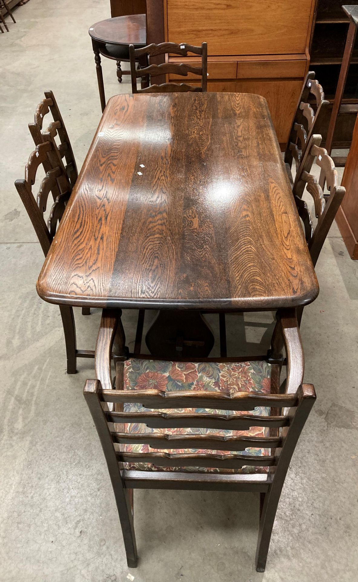 An oak refectory dining table 150cm x 74cm together with six oak ladder back dining chairs (two