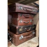 Five various brown fibre and leather suitcases (MST)