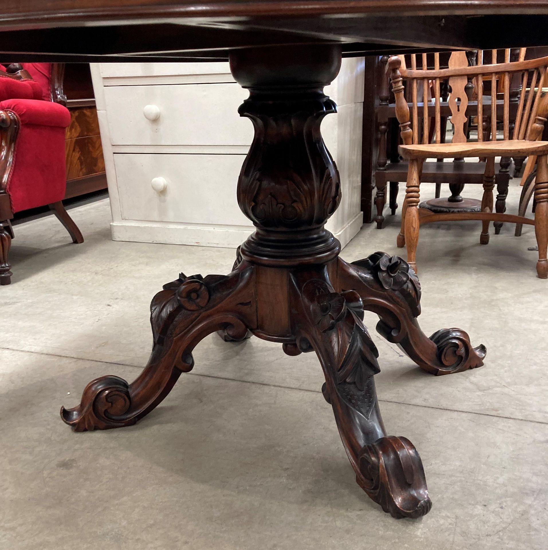 A mahogany Victorian style circular dining table on bulbous centre column support with four carved - Image 2 of 4
