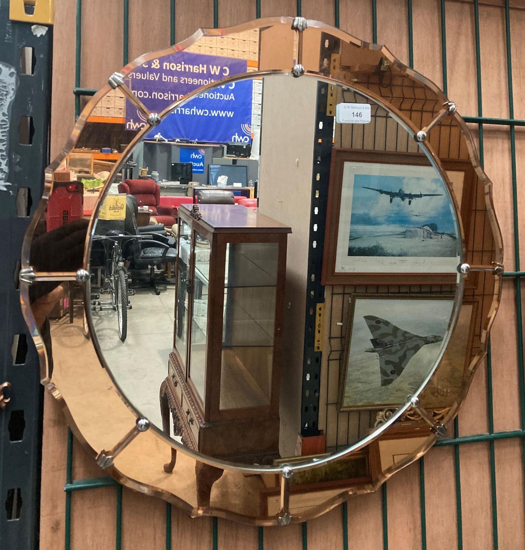A two tone coloured Deco style circular wall mirror,