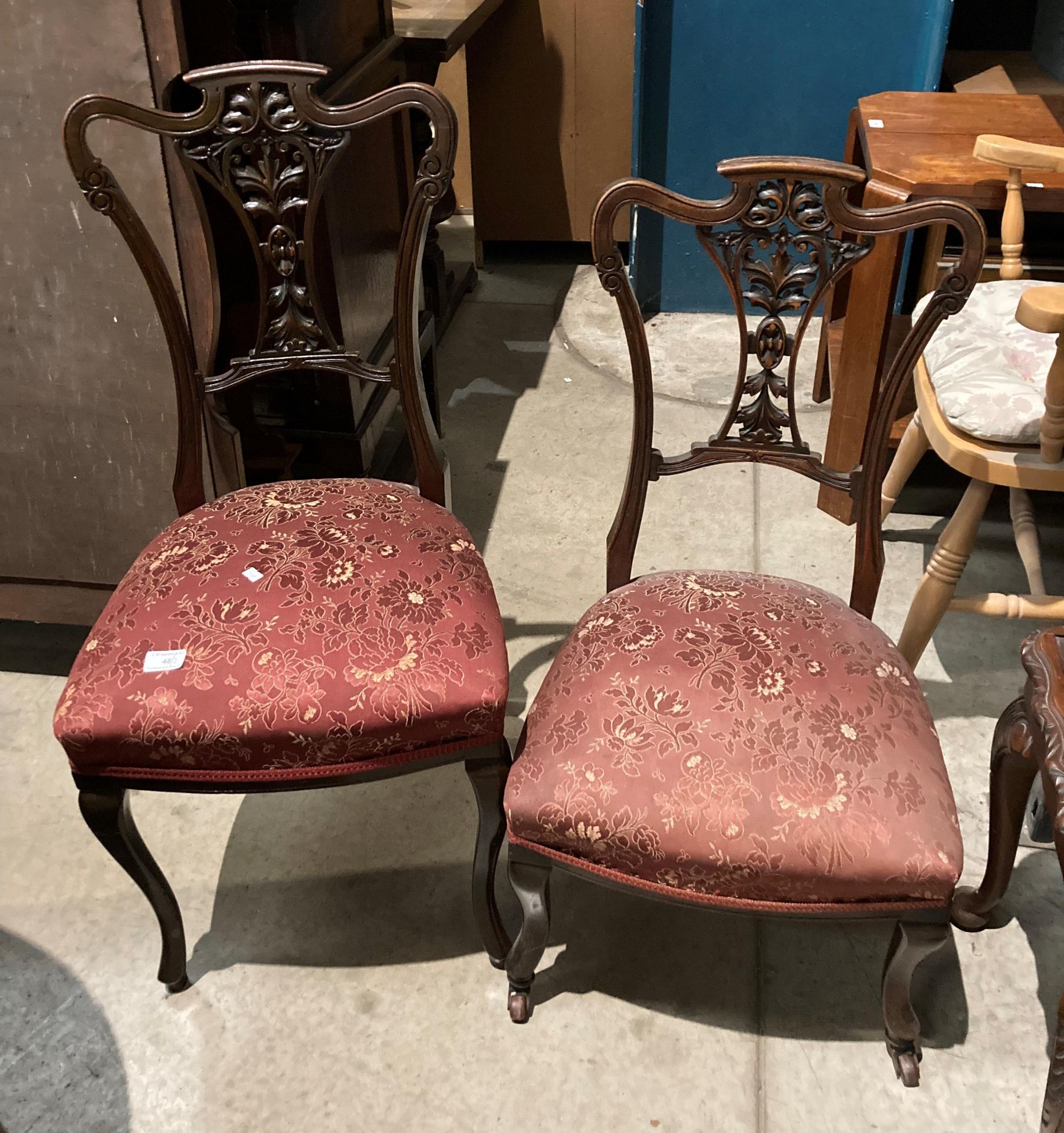 A pair of mahogany salon chairs with carved centre splat back and red patterned fabric seats, - Image 2 of 2