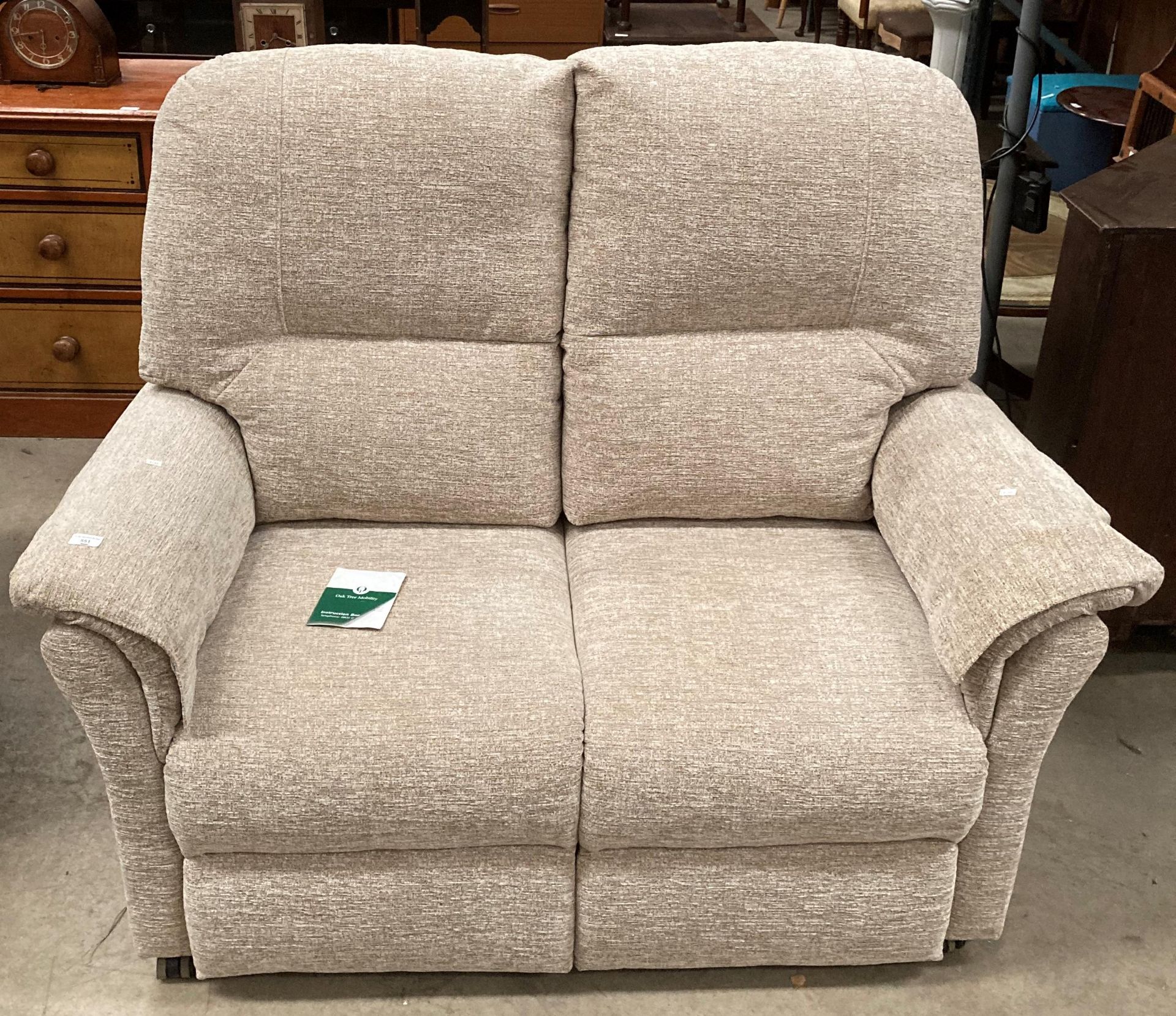 An Oaktree mobility oatmeal upholstered two seater settee (MS)