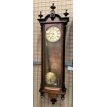 A mahogany cased Vienna style wall clock, 105cm complete with pendulum,