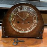 An oak mantel clock complete with key (MST)