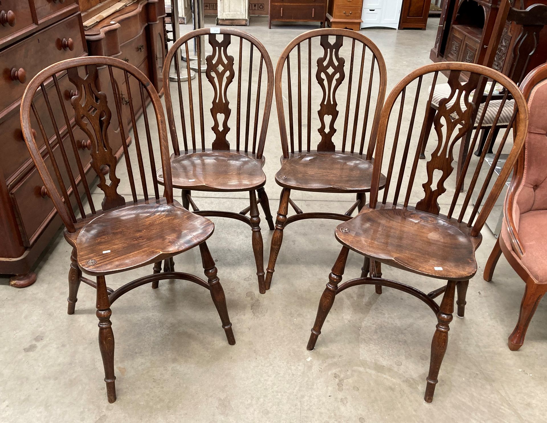 A set of four Yorkshire Rose oak wheel back with centre splat dining chairs (MS)