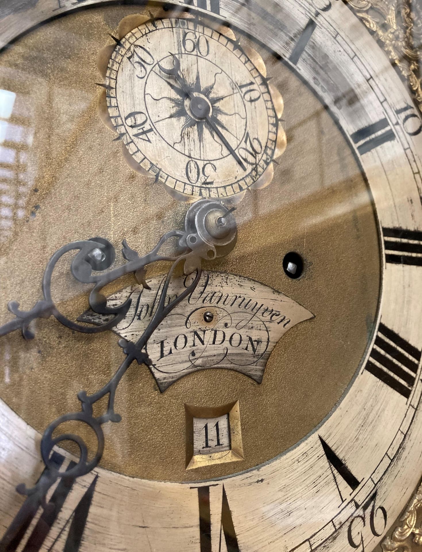 A carved oak long case clock with brass and metal face signed John Vanruyven, London, - Image 3 of 3