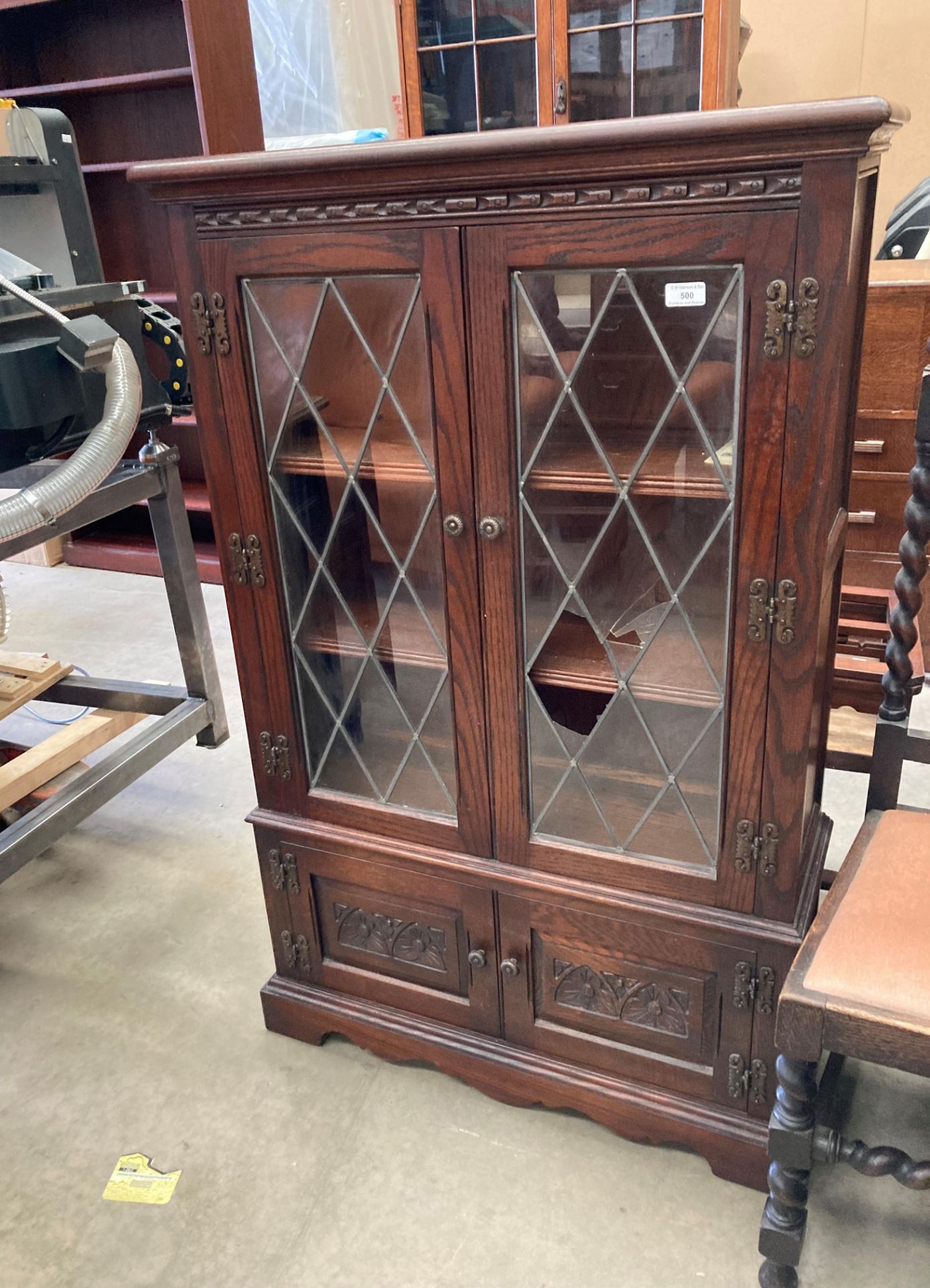 An Old Charm oak display cabinet with two leaded glazed doors (one damaged) over two door base, - Image 3 of 4