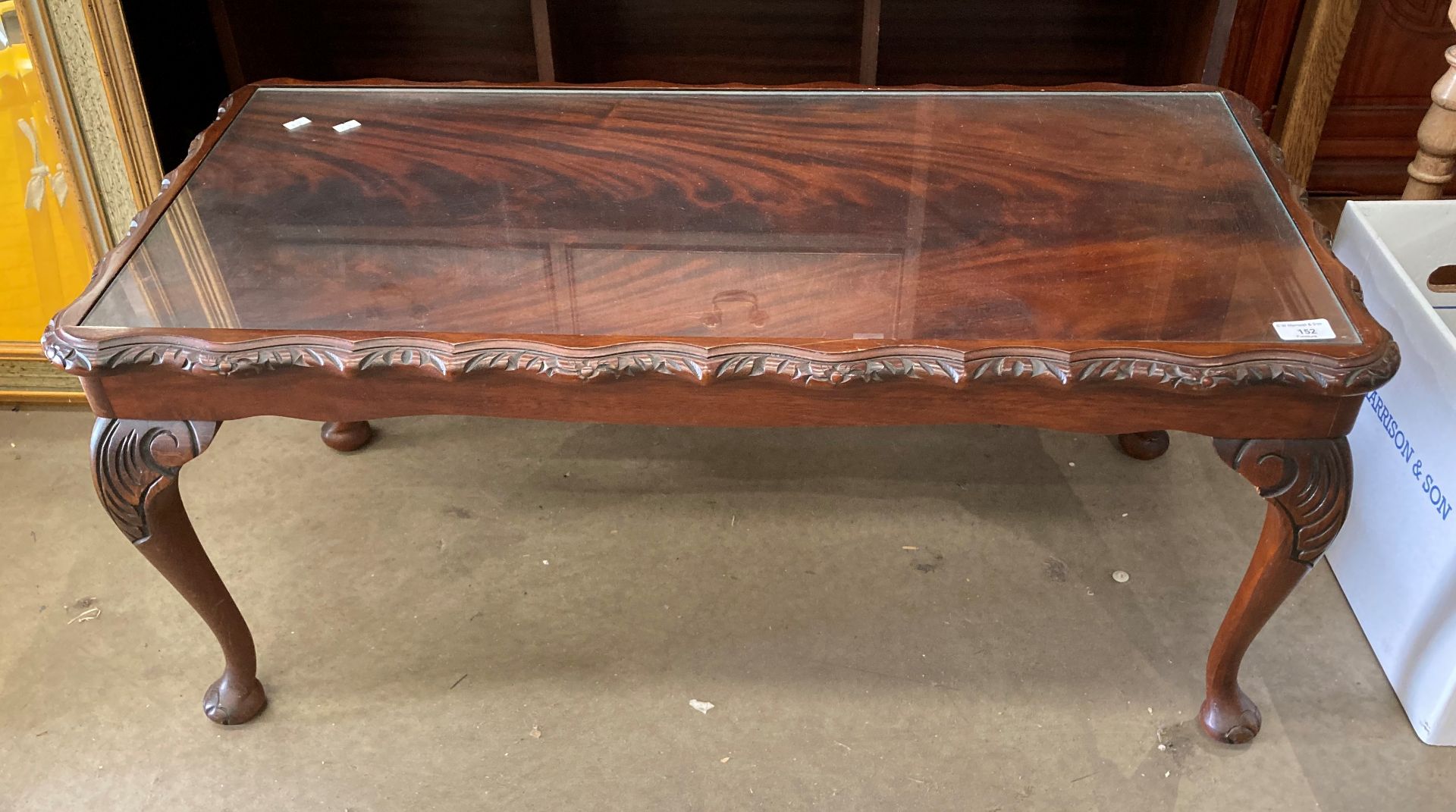 A walnut coffee table on cabriole legs with glass inset top 100cm x 46cm (MST)