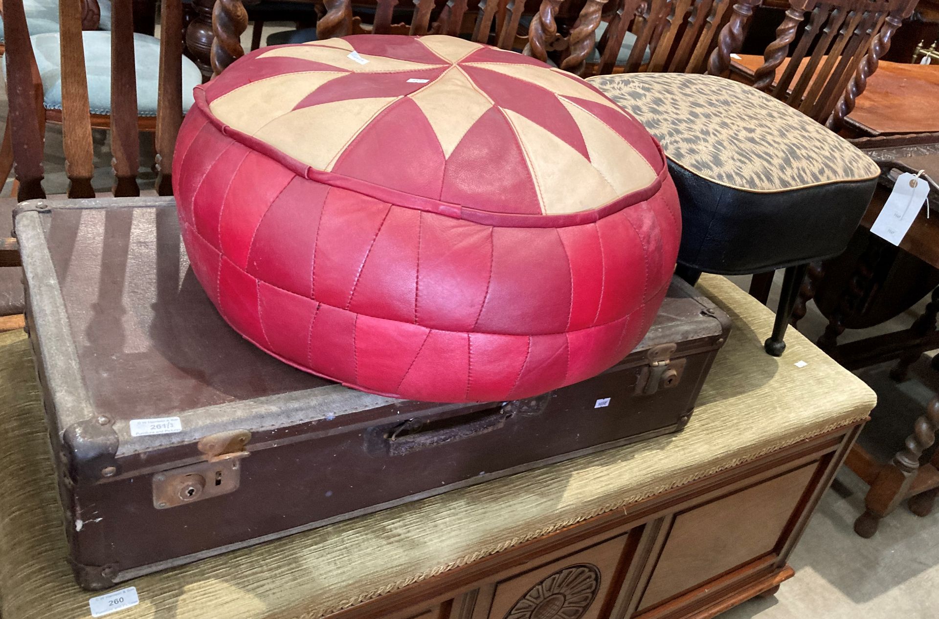 A red and cream patterned vinyl pouffe,