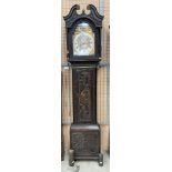 A carved oak long case clock with brass and metal face signed John Vanruyven, London,