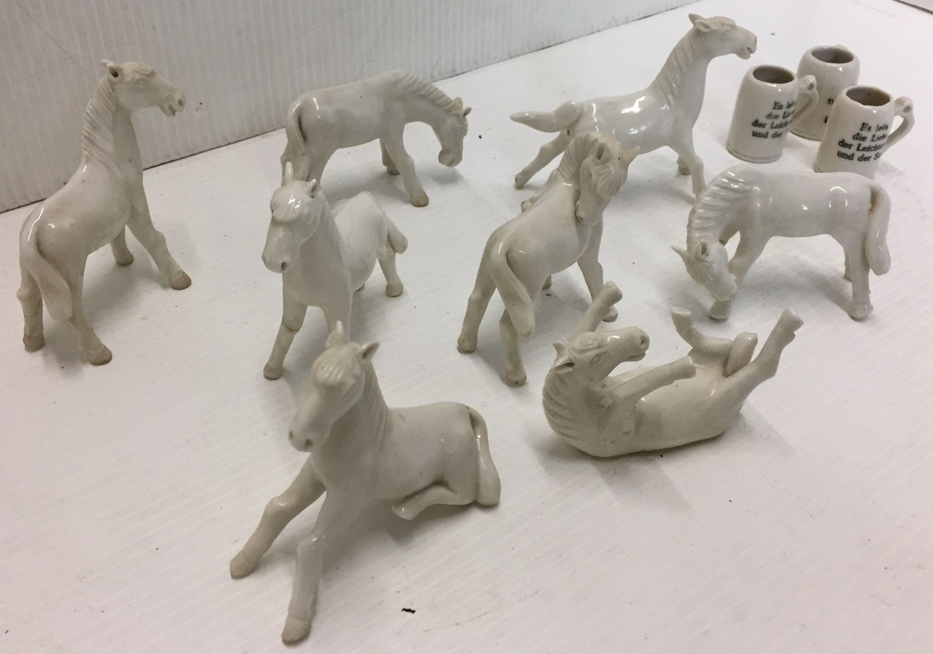 Eleven items including eight white horses max height 8cm and three miniature steins 3. - Image 2 of 3