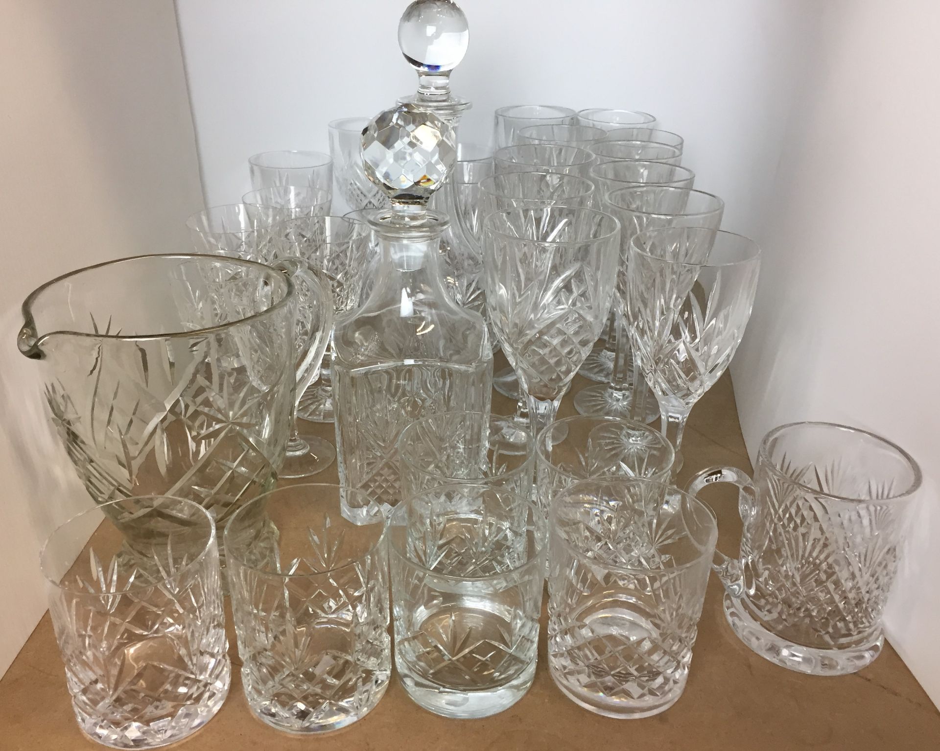 Thirty three items of cut glass including whisky decanter, wine decanter, water jug, wine glasses,
