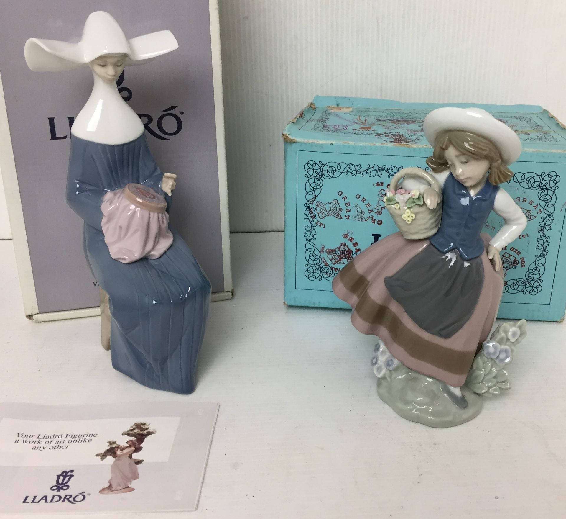 Two Lladro figurines - Time to Sew (blue) 20cm high and Linda Con Cesta 17cm high both with boxes