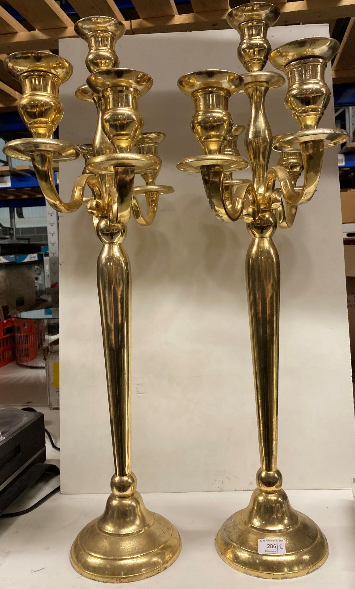 Two gold painted metal four stem,