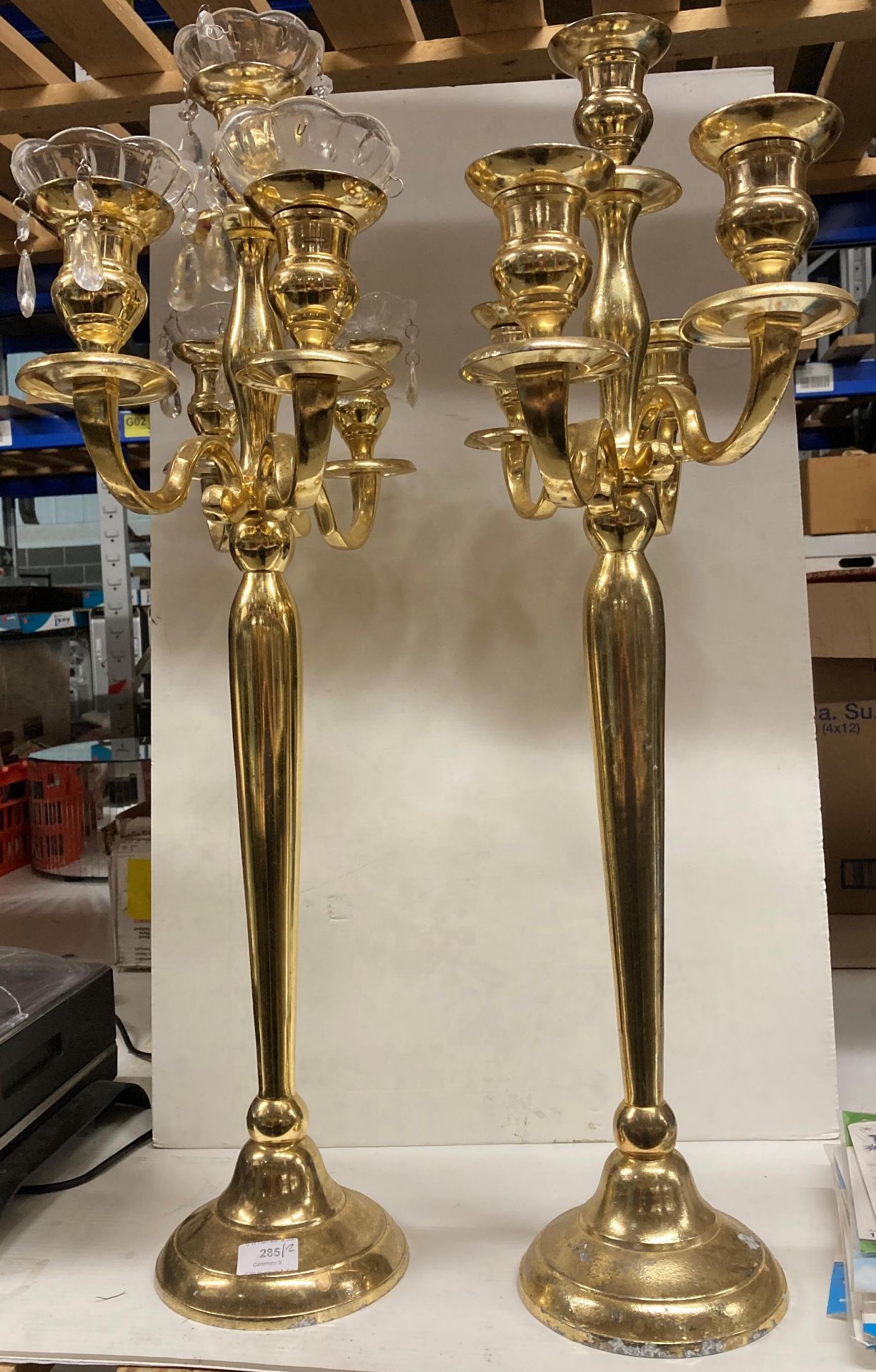 Two gold painted metal four stem,