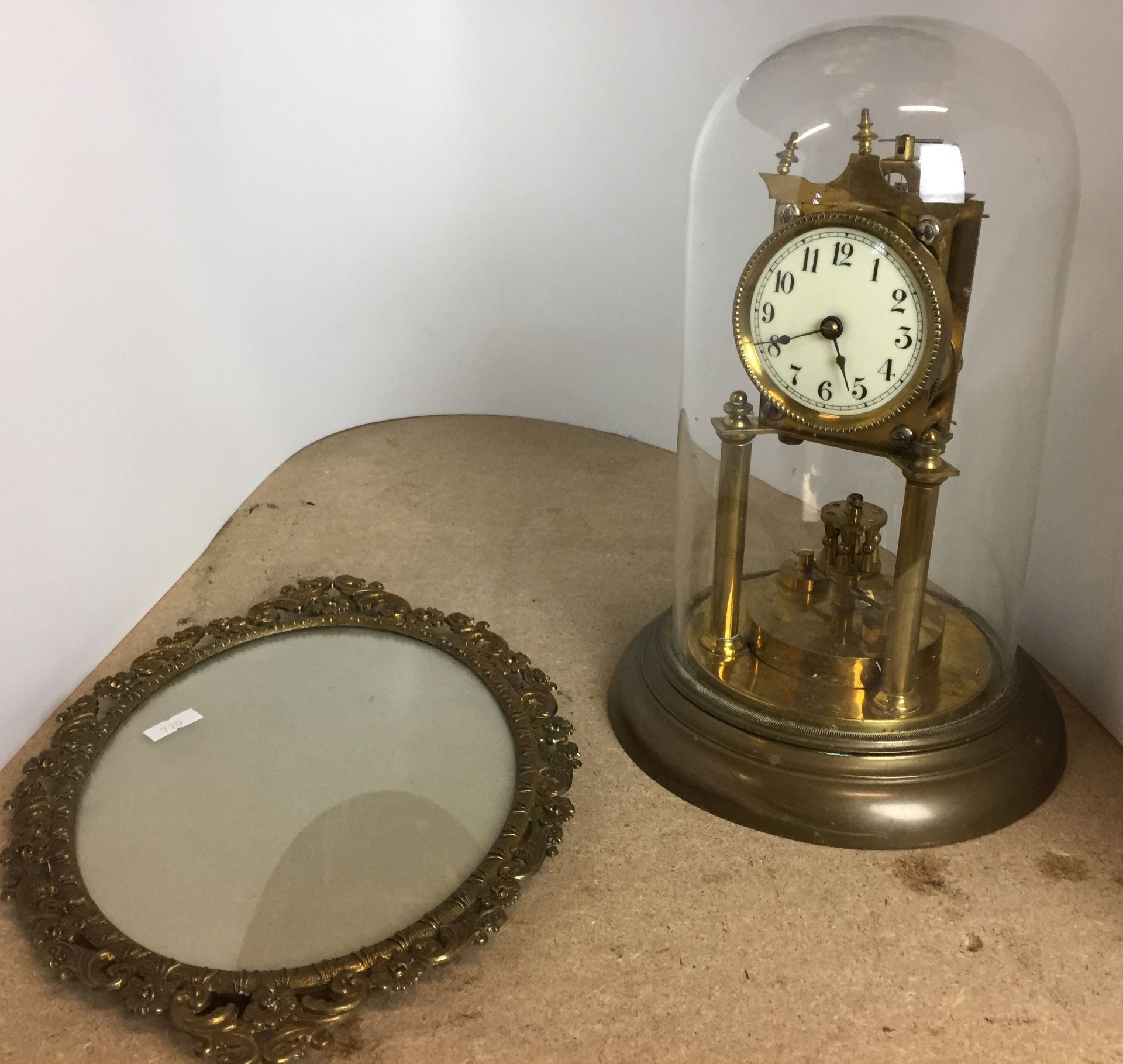 Two items - brass clock in need of repair with glass dome and brass base 29cm including dome,