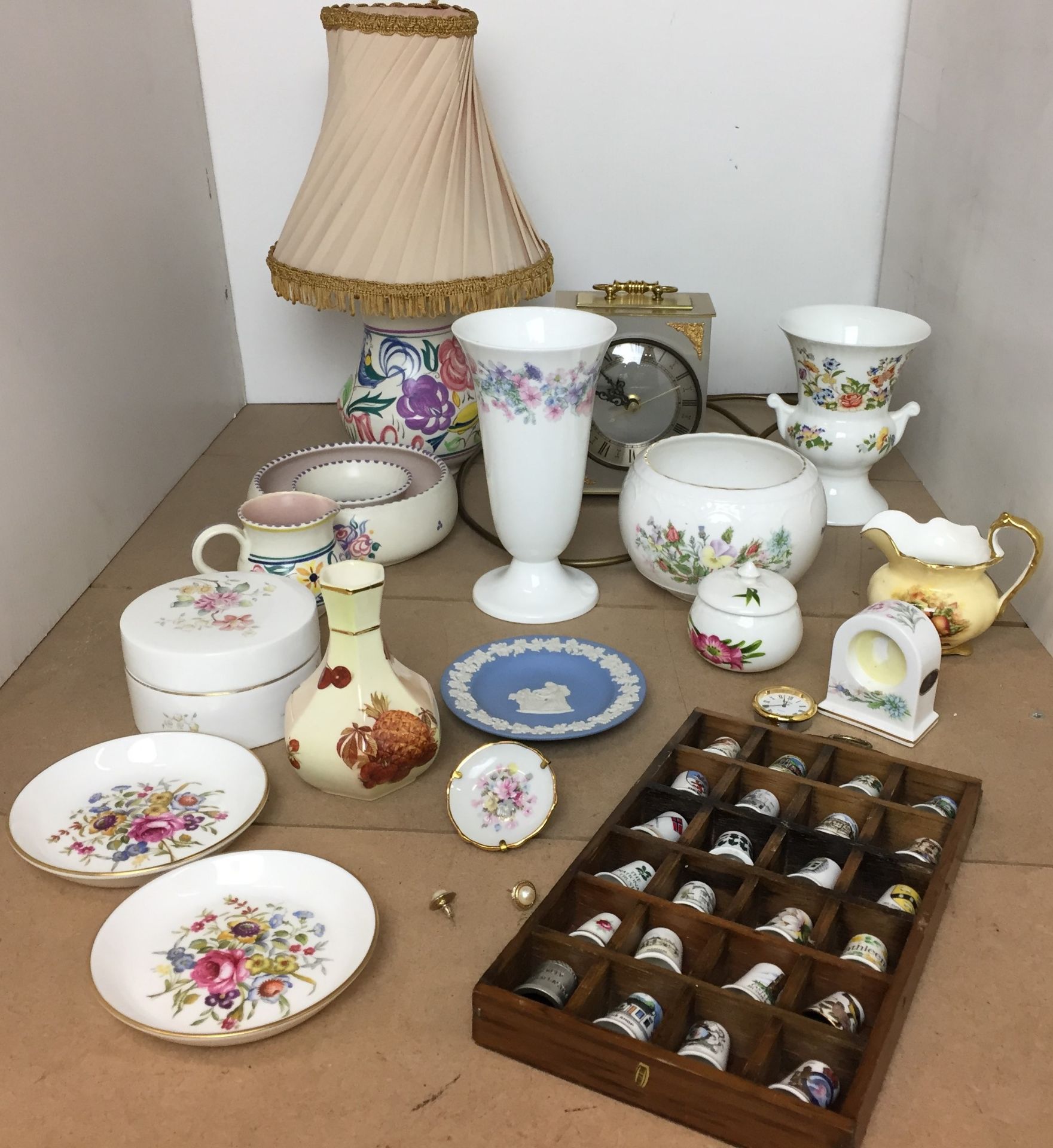 Fifteen items including 24 assorted China thimbles in wooden stand,