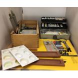 Contents to part of shelf - two artists boxes containing artists materials including paints,